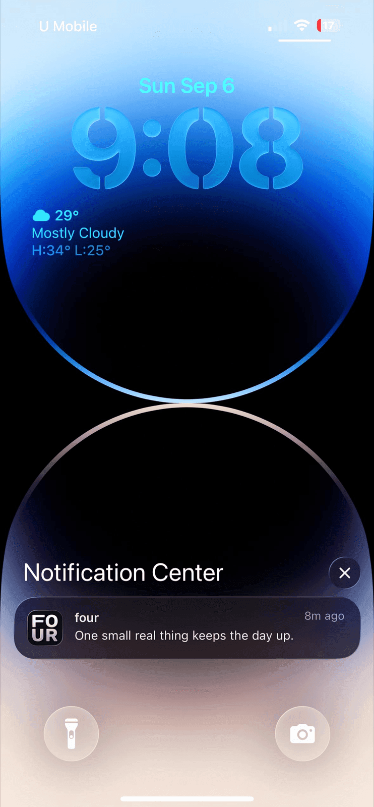 An iPhone lock screen at 9:08 on Sunday, September 6, showing a single notification from FOUR in Notification Center that reads "One small real thing keeps the day up."